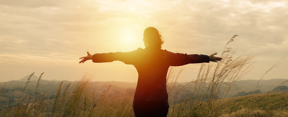 Woman wear winter clothes, stand arms to see nature