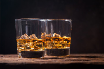 Whiskey with ice in glasses