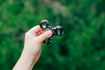 Fidget spinner in the hands of a boy