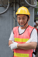 portrait of confident electrician or consturction worker arm crossed