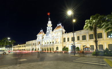 Fototapeta na wymiar Ho Chi Minh City, Vietnam - July 9, 2017: Beautiful People's Committee Building at night with many lights illuminating buildings with ancient architecture adorn the face of Ho Chi Minh City, Vietnam. 