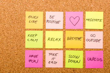 slow down, relax, take it easy, keep calm and other motivational lifestyle reminders on colorful sticky notes