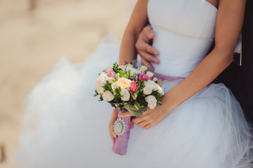Bride holding big wedding bouquet on wedding ceremony