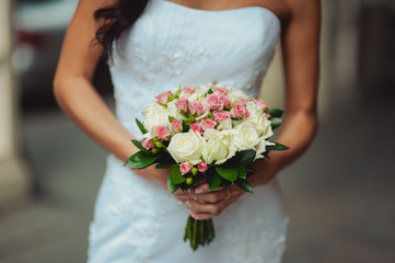 Obraz na płótnie Canvas Bride holding big wedding bouquet on wedding ceremony