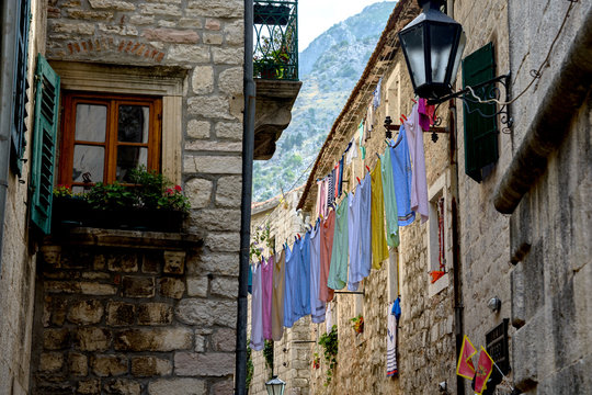 Multicolored Towels Hang On A Rope In The Street Of The Old Town Of Kotor, Montenegro