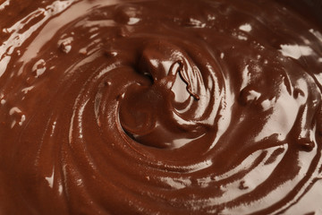 Delicious melted chocolate sauce as background