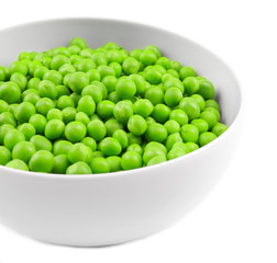Bowl with fresh green peas on white background, closeup