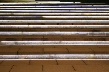 illuminated wet stairs at night. background.