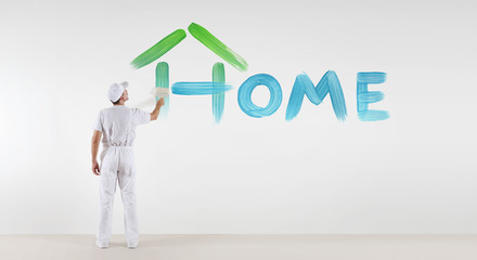 painter man with paint brush painting home text word isolated on blank white wall background, ecology concept