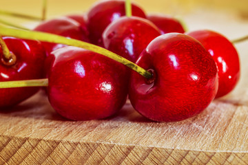 Sweet cherry on a wooden surface