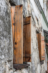 Old window on ancient wall