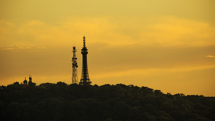 Obraz premium Silhouette Petrin Tower. Prague, Czech Republic. Silhouettes of towers and castle.