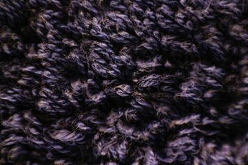 Texture of pile of dark blue fabric. Macro. Closeup. Isolated on a white background