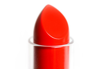 The tip of the red lipstick. Macro. Closeup. Isolated on a white background