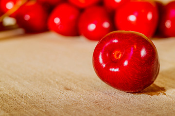 Sweet cherry on a wooden surface