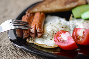 fried egg sausages tomatoes for healthy breakfast