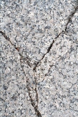 cracked gray granite stone. background, texture