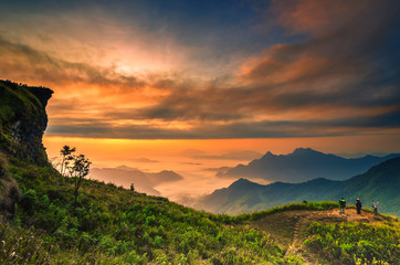 Background blur sea fog on the mountain with the sky and clouds of yellow, orange, Phu Chi Fa Thailand. - obrazy, fototapety, plakaty