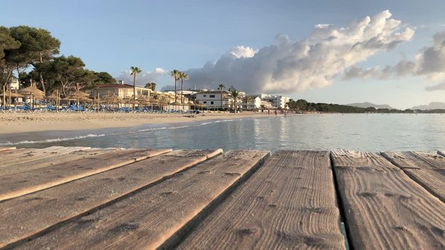 Rustic wooden pier ona Playa de Muro, Mallorca