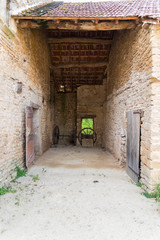 Fototapeta premium Wheel of plow in an old barn, agricultural machines