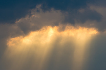 Fototapeta na wymiar Sun rays through clouds like an dramatic explosion , power nature background.