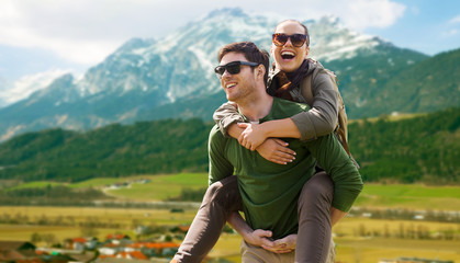 happy couple with backpacks traveling in highlands - obrazy, fototapety, plakaty