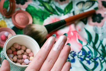 Highlighter pearl color for face and shining powder, makeup brushes. Fashionable glitter make up at home