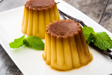 Creme caramel. Egg pudding on wooden table
