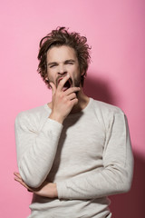 sleepy man with long uncombed hair wake up in morning