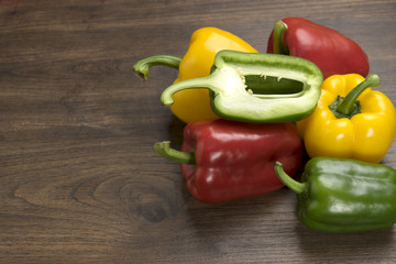 group of bell peppers on wood