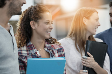 Group of students in business training standing in office