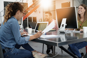 Trendy young people working in co-working office