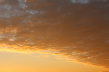 Naklejka na ściany i meble Yellow clouds sunset