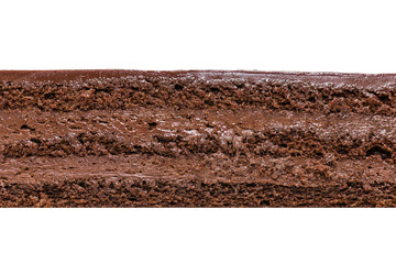 Prague cake texture on white background. Chocolate biscuit, delicate chocolate cream and chocolate glaze