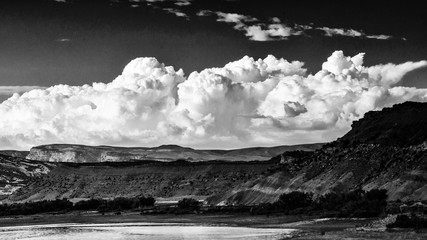 Black and white storm clouds building over Utah mountains
