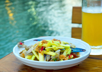 Crab salad as a snack, served with beer. As the popularity of Thailand.