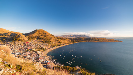 Fototapeta na wymiar Panoramic view of Copacabana Bay on Titicaca Lake from the summit of Mount Calvario (3966 m), among the most important travel destination in Bolivia.