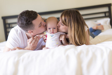 Portrait of parent with her 3 month old baby in bedroom
