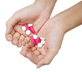 hands holding bunch of pills is on white background with clipping path , overdose concept