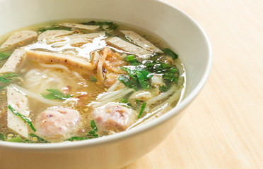 Vietnamese soup Pho Bo with vegetables and rice noodles in a bowl