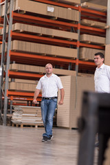 Fototapeta premium designers in their furniture manufacturing workshop