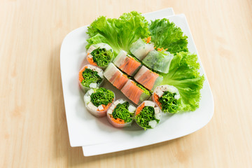 Fresh vietnamese spring rolls (Goi cuon) on a plate with salad. Can use to create menu in the restaurant.