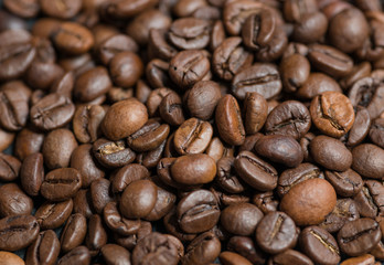 Roasted coffee beans on dark background. Selective focus.