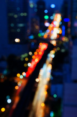 Background blur bokeh in the streets and opened fire at the building in the city during the night.