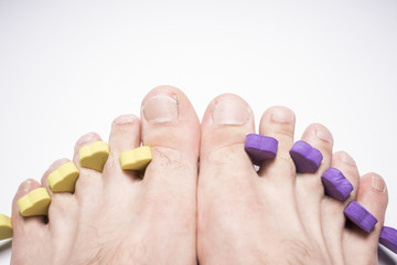 Male pedicure isolated on white