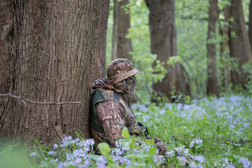 Hunter patiently waiting in the forest
