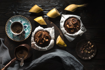 Banana cupcakes and coffee on the wooden table horizontal