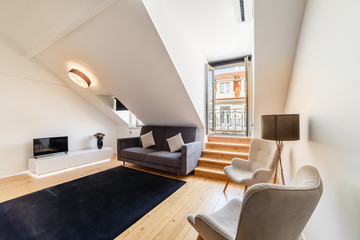 Fototapeta na wymiar Modern apartment with white walls and light wooden floor