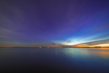 Soon after sunset on lake with stars