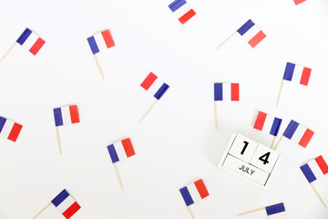 Fototapeta na wymiar 14 july Wooden calendar and Happy Bastille Day. Concept National Day France,independence day of France